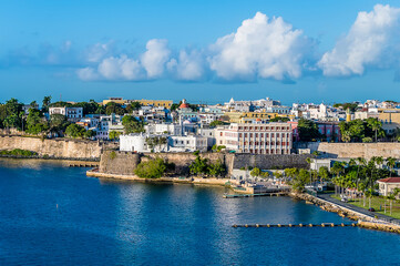 Fototapeta na wymiar A view along shore at the harbour entrance in San Juan, Puerto Rico on a bright sunny day