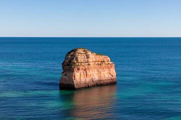 Landscape of the rocky coast of the Algarve - Portugal in the evening