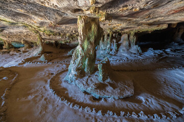 Close up view of mountain cave with beautiful stalactites. Aruba island.