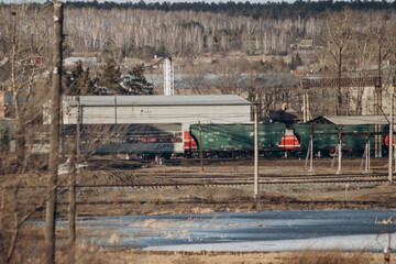 View of the autumn small town. Industrial area and railway.