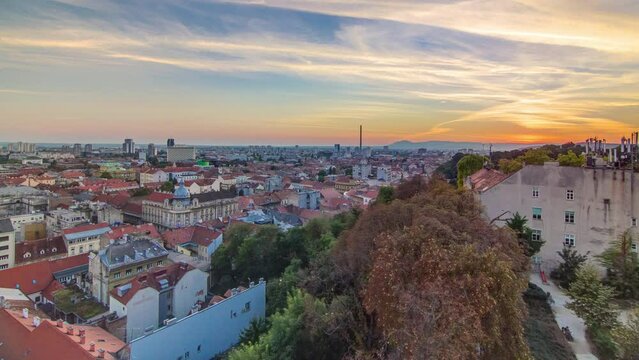 Aerial view at Zagreb downtown timelapse, beautiful sunset, Croatia capital city. Aerial cityscape Zagreb town. Top view from Kula Lotrscak tower viewpoint