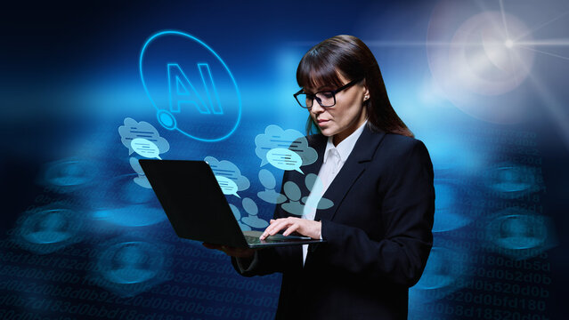 Middle aged business woman using laptop ai to chat with colleagues