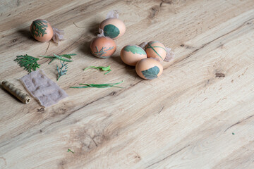 Interesting method for decorating easter eggs with leaves. Eggs decoration with leafs. Easter eggs decoration with leaf pattern. copy space