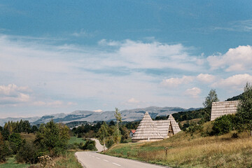 Road to the village with conical and triangular houses