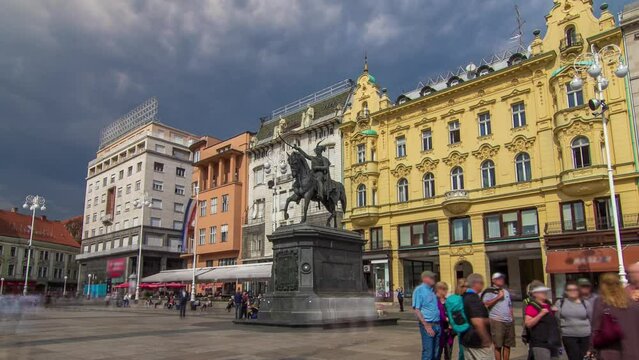 Ban Jelacic monument on central city square (Trg bana Jelacica) timelapse hyperlapse in Zagreb, Croatia. Colorful historic buildings and people walking around