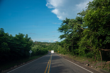 White truck on a rural highway in Colombia.