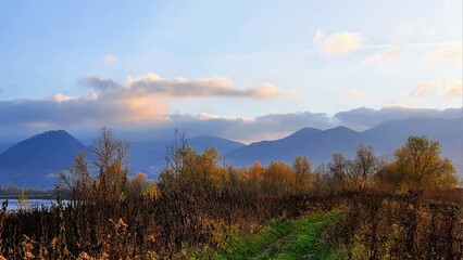 autumn landscape with blue mountains and blue sky