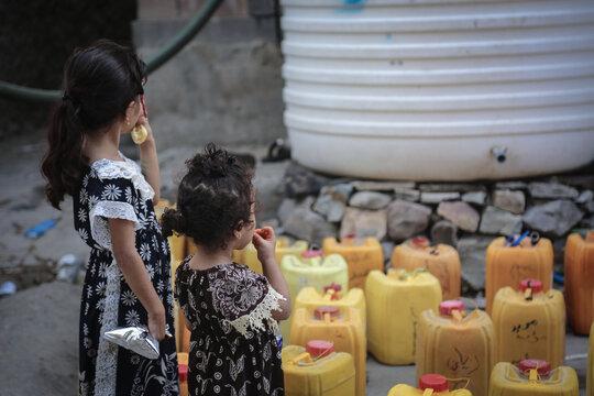 A Yemeni girl fetches water due to the water crisis in the city of Taiz	