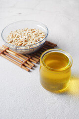 overhead shot view peanuts and oils in a container 