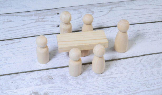 Group Of Multi-Ethnic People Working On Digital Devices Around Table.
