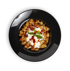 Turkish Dumplings (Mantı) in black plate isolated close up png file.