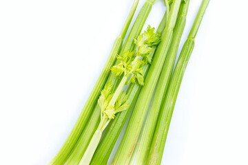 Obraz premium Fresh celery on white background. Top view