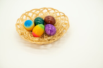 Easter Egg. set of multicolored painted eggs in a basket with straw .Easter food.Spring religious holiday.
