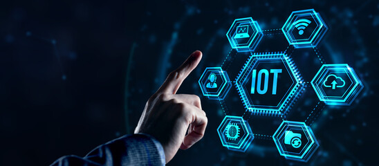 Internet of things - IOT concept. Businessman offer IOT products and solutions. Internet, business, Technology and network concept. Virtual button.