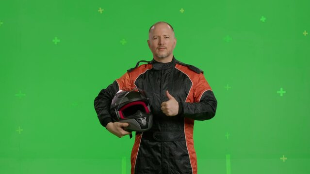 Close-up a racer in a racing suit on green screen background, chroma key