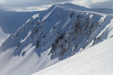 Avalanches descend among the rocks in the mountains