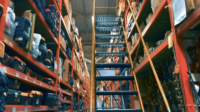 Shelves with goods and tools for home and repair in the warehouse of the DIY store