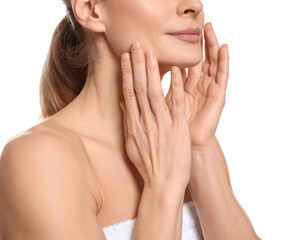 Woman massaging her face on white background, closeup