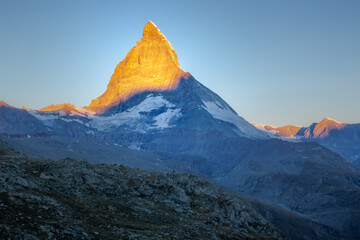 Reflection of the Matterhorn on blue lake at sunrise, Swiss Alps, Zermatt