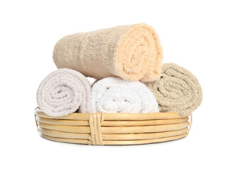 Fototapeta na wymiar Wicker basket with rolled bath towels isolated on white