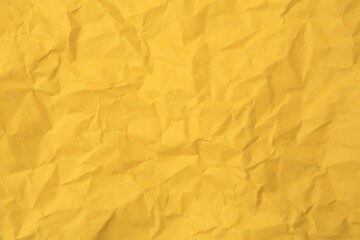 Sheet of crumpled orange paper as background, top view