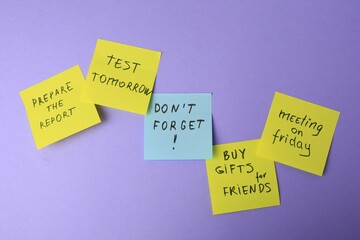 Many different reminder notes on violet background