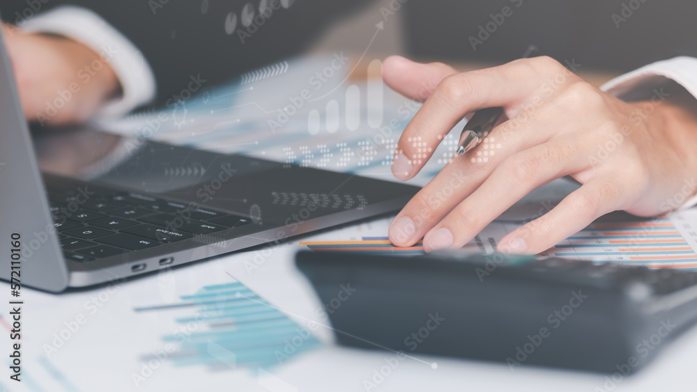 Poster businessman calculating figures in company financial documents with a calculator,analysis of company