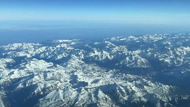 Aerial view from a jet cockpit of the Pyrenees mountains from a jet cockpit flying notrhbound at 12000m high. Pilot point of view. 4k