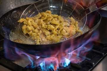 cooking fish in a pan