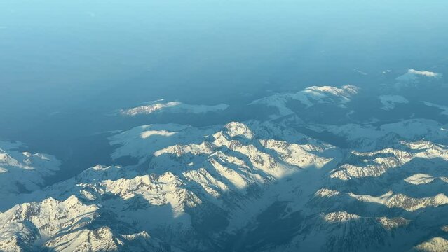 Pyrenees mountains from a jet cockpit suring sunset. Pilot point of view. Golden minute. 4k