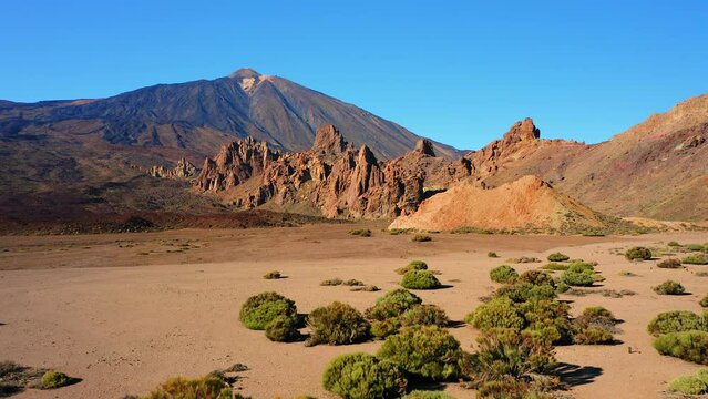 Mountain range in dry deserted landscape of Teide National Park. Scenery of highest volcano in Spain.