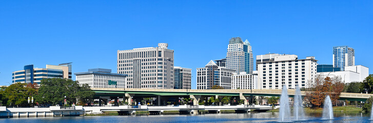 Panoramic view of downtown Orlando skyline with condo and business buildings in Orange County, Orlando, Florida, USA. - obrazy, fototapety, plakaty