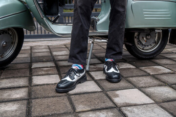 These hand-made black-and-white wingtip shoes with loafers sole made from genuine leather are being...