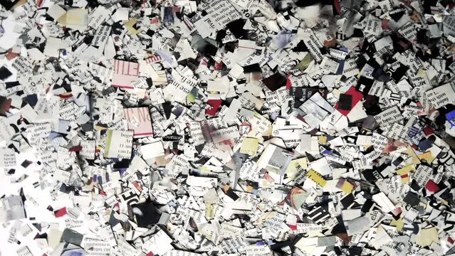 The word NEWS spinning with newspaper confetti 