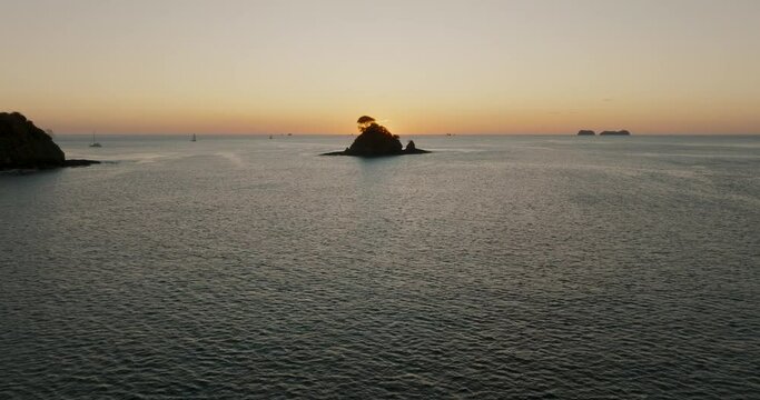 Drone Flying Towards Islet At Dusk In The Paradise Beach In Costa Rica Near Guanacaste In Central America. Aerial Shot