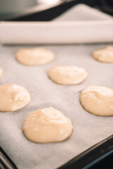 Fototapeta na wymiar circles of dough on a baking sheet