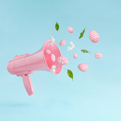 Pink megaphone with little white Easter bunnies pink easter eggs and green leaves against pastel...