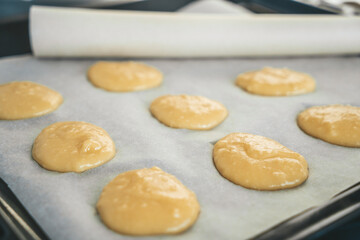 circles of dough on a baking sheet