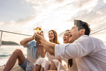 Group of diverse friends drink champagne while having a party in yacht - obrazy, fototapety, plakaty