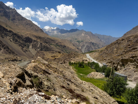 A dirt road in Tajikistan and Panj River in Afghanistan.