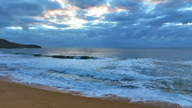 Aerial sunrise seascape with clouds at Killcare Beach on the Central Coast, NSW, Australia.