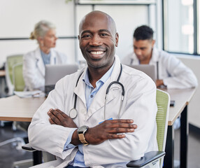 Arms crossed, portrait and a black man in healthcare workshop with vision and motivation. Happy, medicine and an expert African doctor in medical meeting, seminar or conference at a hospital