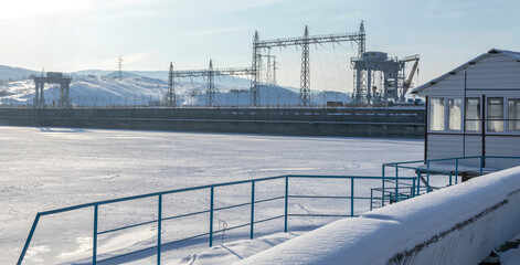 Naklejka premium construction of a hydroelectric power station on the Irtysh river in winter