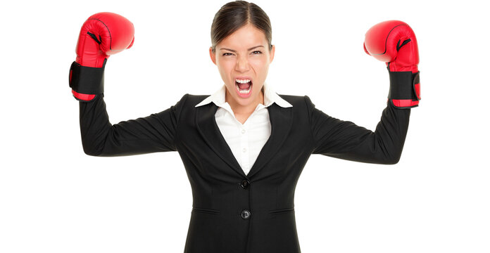 Boxing Gloves Business Woman Angry - Business Concept Showing Aggressive Business Boxer Flexing Muscles Isolated Cutout PNG On Transparent Background. Mad Multiracial Businesswoman.