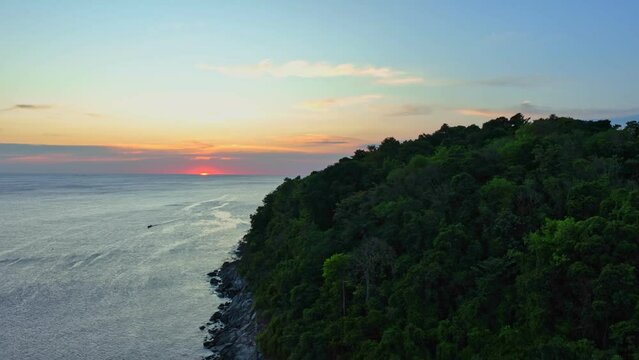 .aerial view beautiful sunset above Kala island at Layan beach Phuket..colorful sky of sunset at horizon.Phuket beach sea Amazing beach, .Beautiful beach Phuket Thailand, Nature and travel concept.