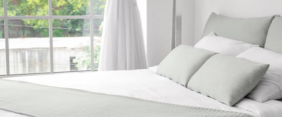 Big comfortable bed in light hotel room