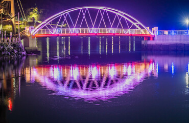 Pedestrian bridge across small seaport