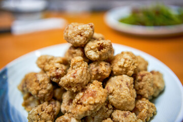 A plate of crispy and delicious fried crispy meat close-up