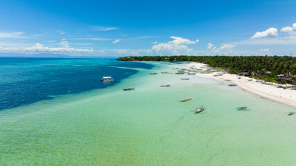 Aerial view of tropical sandy beach with palm trees. Bantayan island, Philippines.