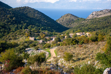 Fototapeta na wymiar View of the oldest village of Corfu island, close to Mount Pantokrator, abandoned village of Sinies Old Perithia. Greece.